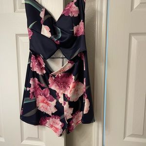 This is a floral cutout romper for any occasion. It can be dressed up or down.